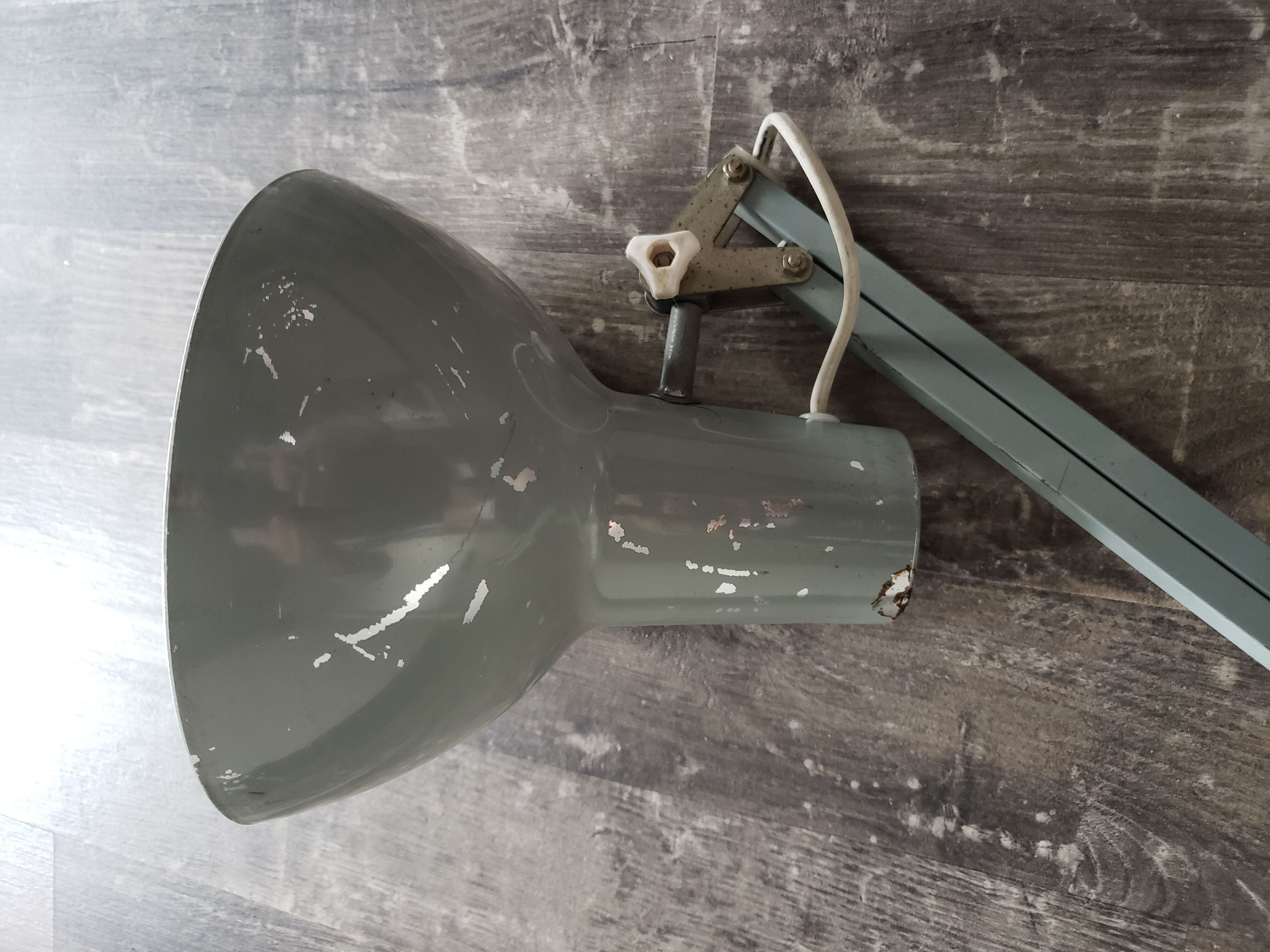 Grey articulated architect lamp to be restored
