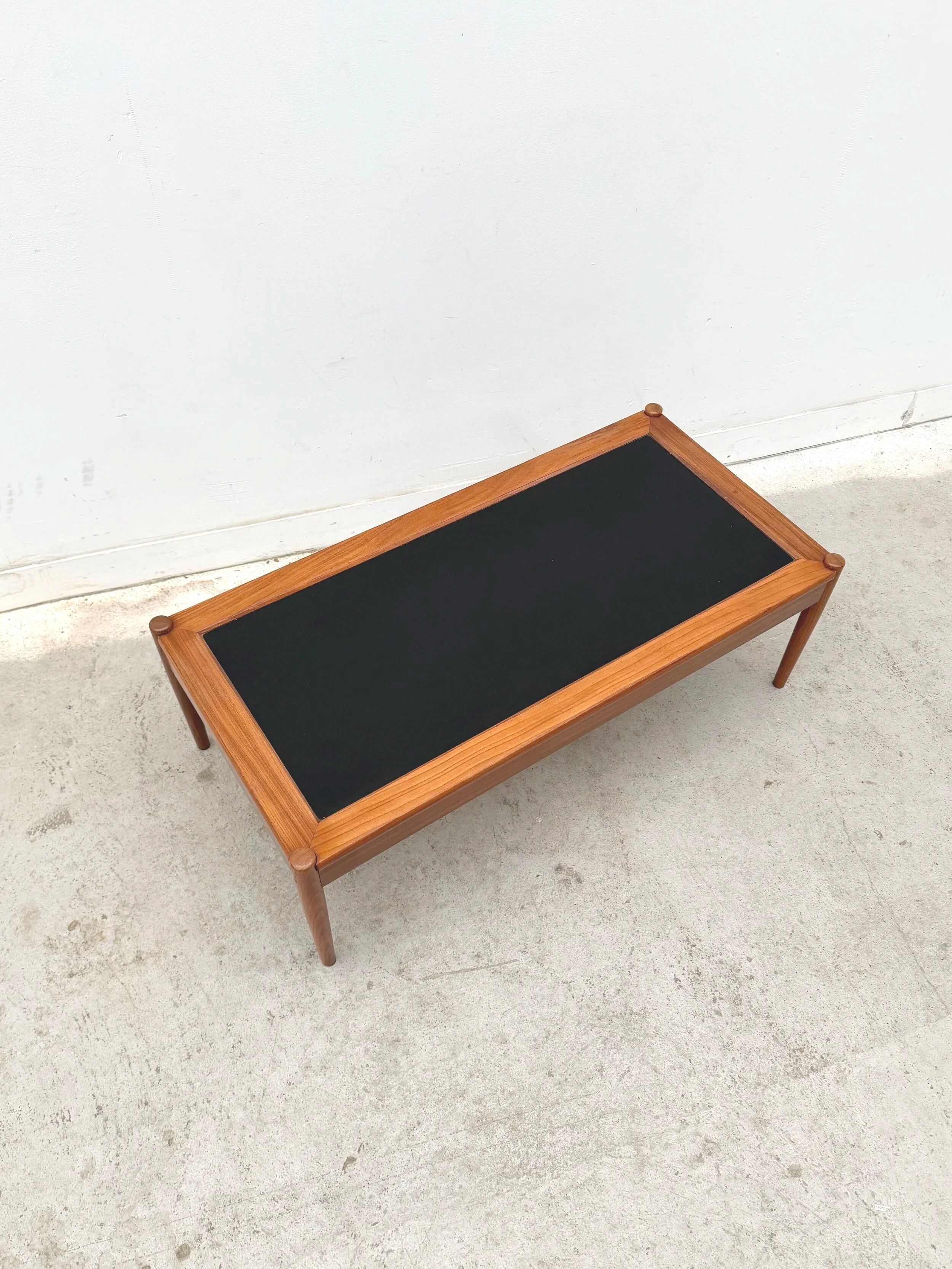 Scandinavian coffee table in teak and black formica, 1960.