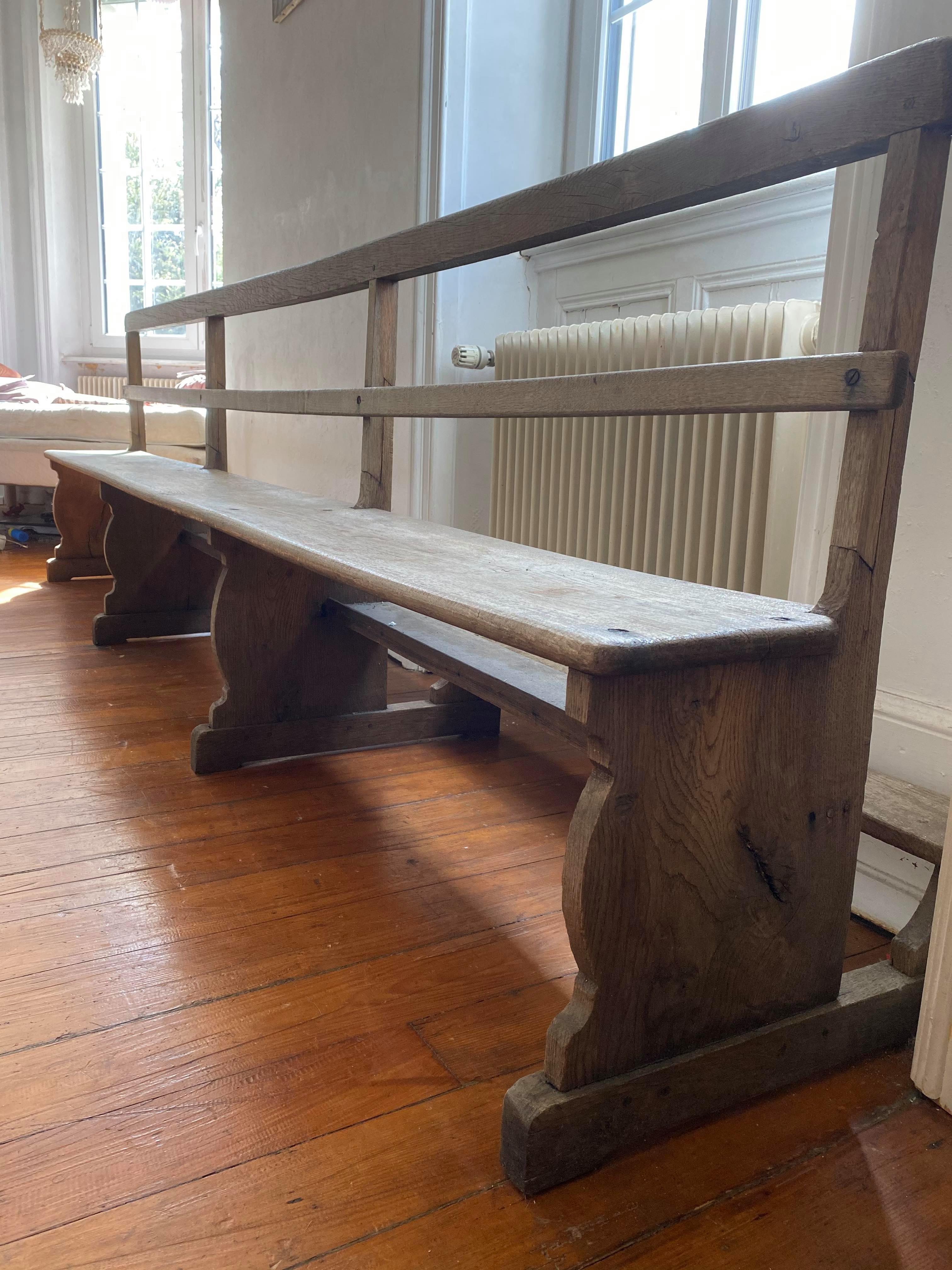 Very large church bench in patinated raw oak