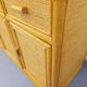 Vintage storage unit in rattan and woven rattan from the 1970s.