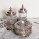 Salt, pepper and mustard shaker set in chiseled glass and silver metal