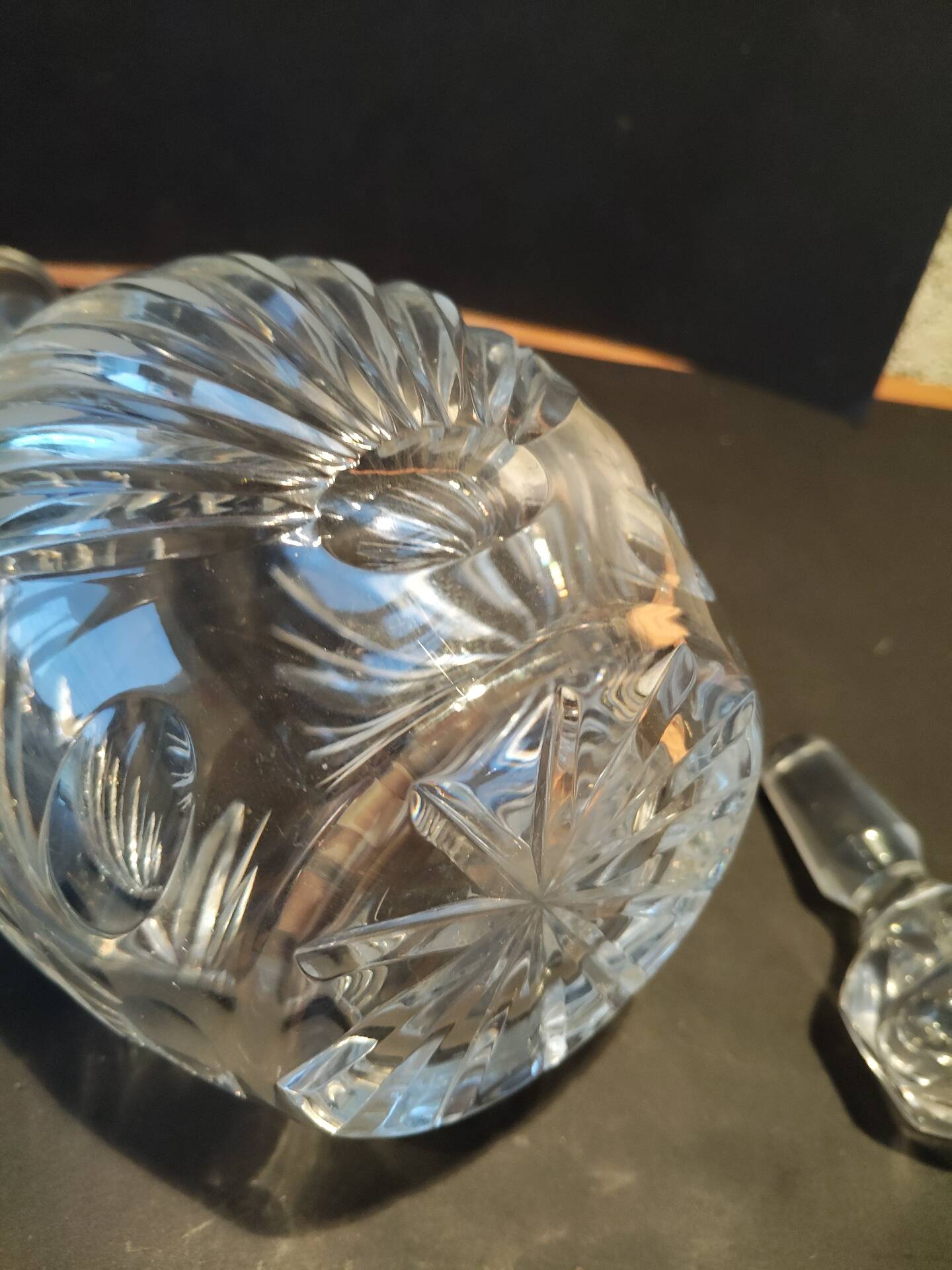 Vintage cut crystal carafe with floral stopper.