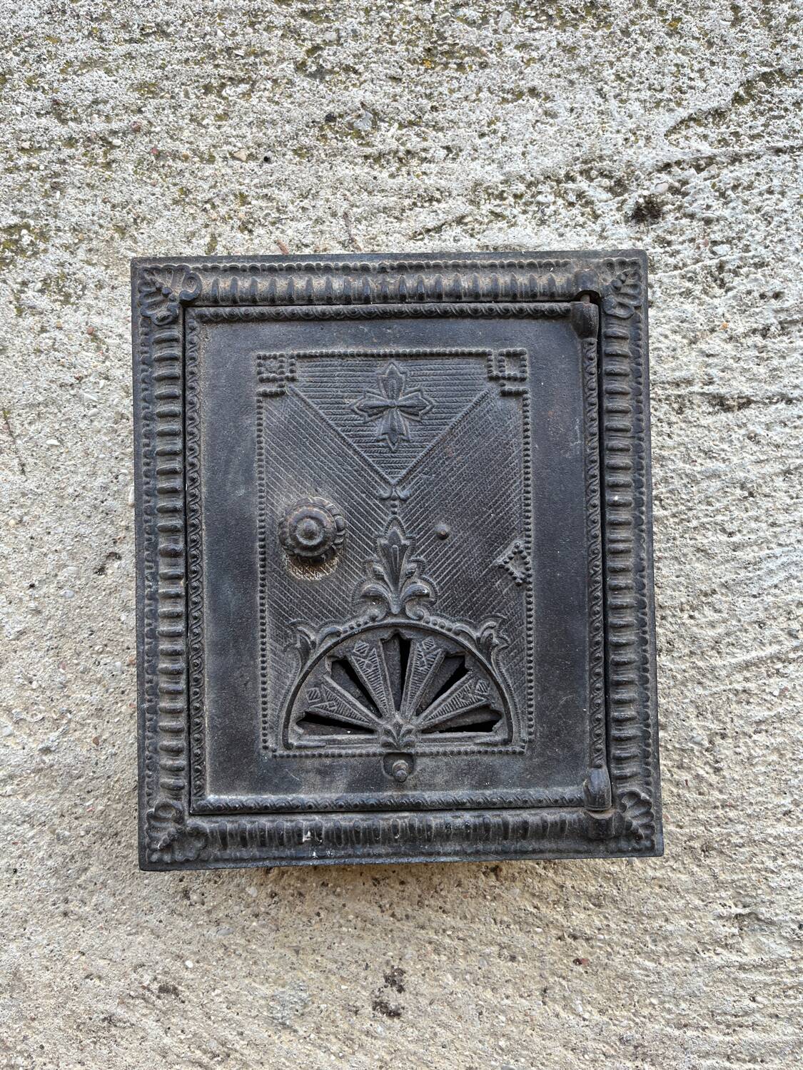 Old 19th century cast iron oven door or fireplace