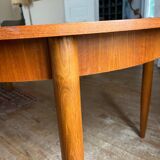 Scandinavian round teak table with butterfly extensions from the 60s