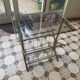 Vintage style side table with magazine holder, gold metal and glass top.
