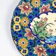 Assiette Longwy 1930 – Émaux à décor d’oiseaux et fleurs oranges