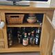 Buffet / TV unit in solid oak with a caned door.