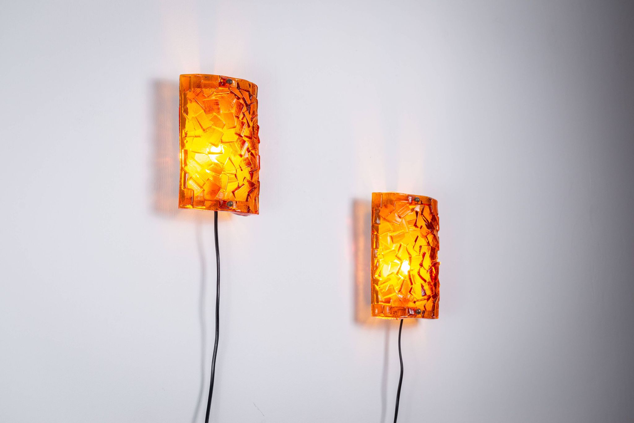 Vitrika Nybro amber coloured wall lamps