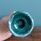 Column candle holder in ceramic with green and gold marble effect.