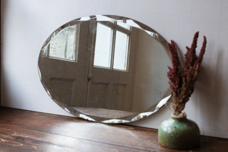 Old oval beveled art deco mirror
