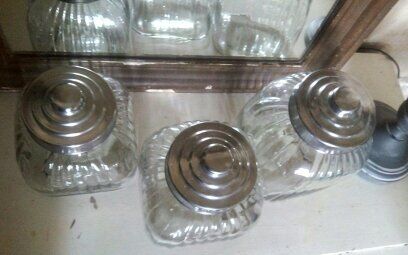 three large glass jars