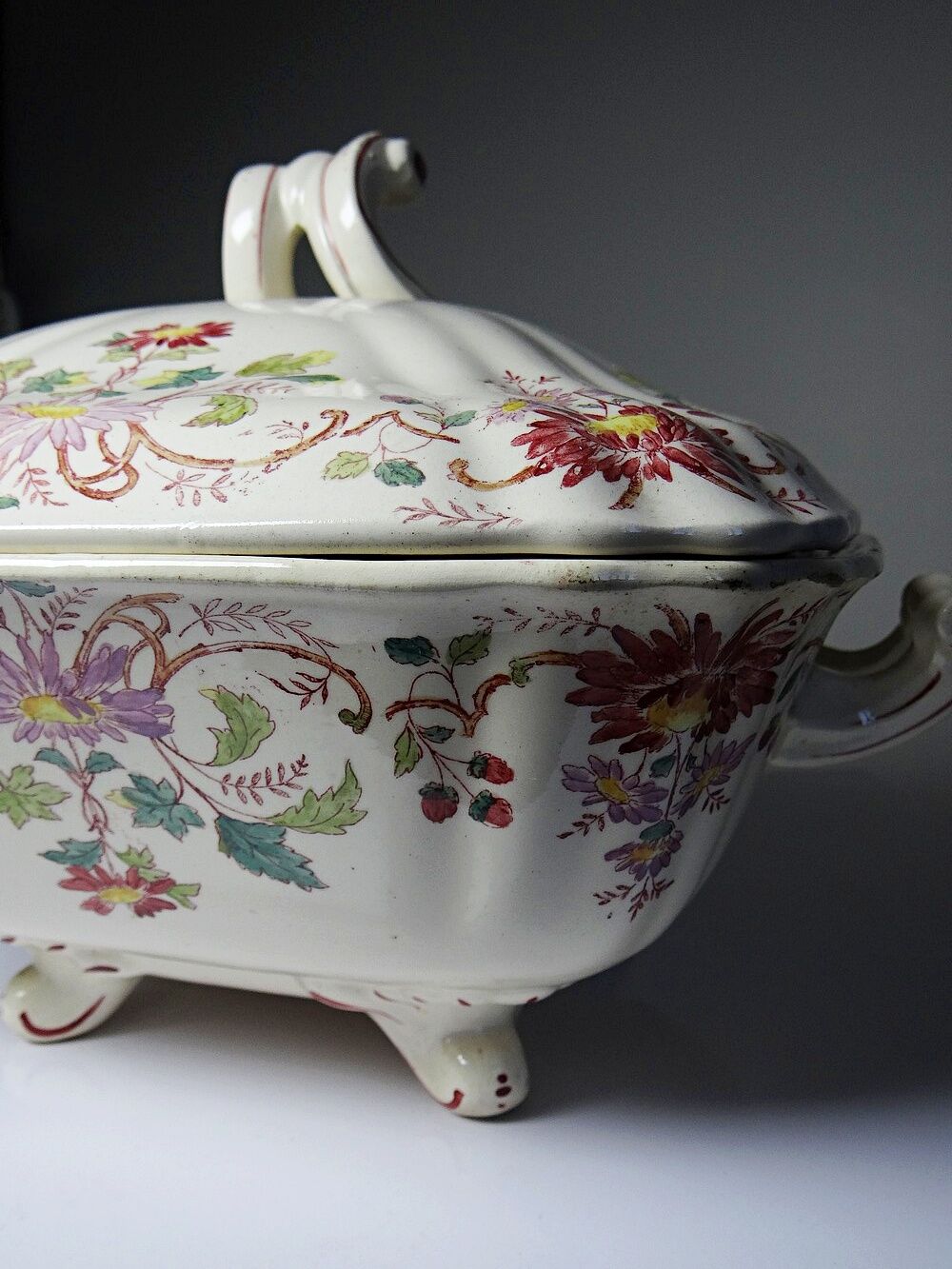 Antique Longchamp soup tureen/vegetable dish with polychrome daisies in ironstone.