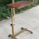 Foldable and adjustable serving trolley in wood and gold-plated steel