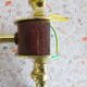 Golden wall lamps with round glass shades and teak veneer