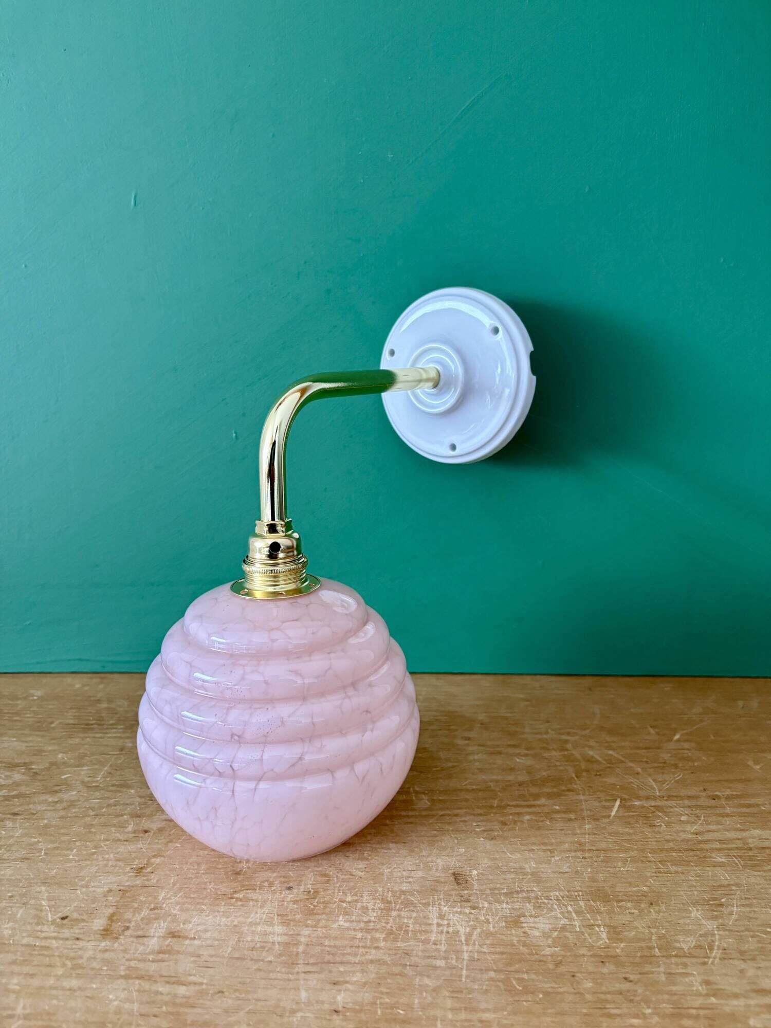 Vintage pink Clichy glass globe wall light.