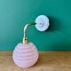 Vintage pink Clichy glass globe wall light.