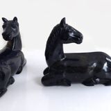 Black marble bookends with lying horses