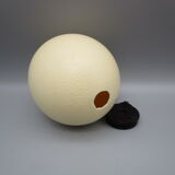 Ostrich egg on pedestal
