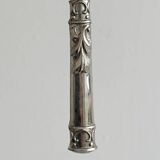 Antique shiny metal cheese cutlery