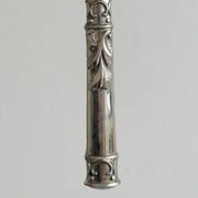 Antique shiny metal cheese cutlery