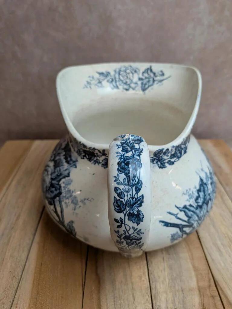 Small chubby antique jug in ironstone – blue floral decoration
