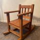 Old children's rocking chair in solid wood