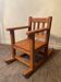 Old children's rocking chair in solid wood