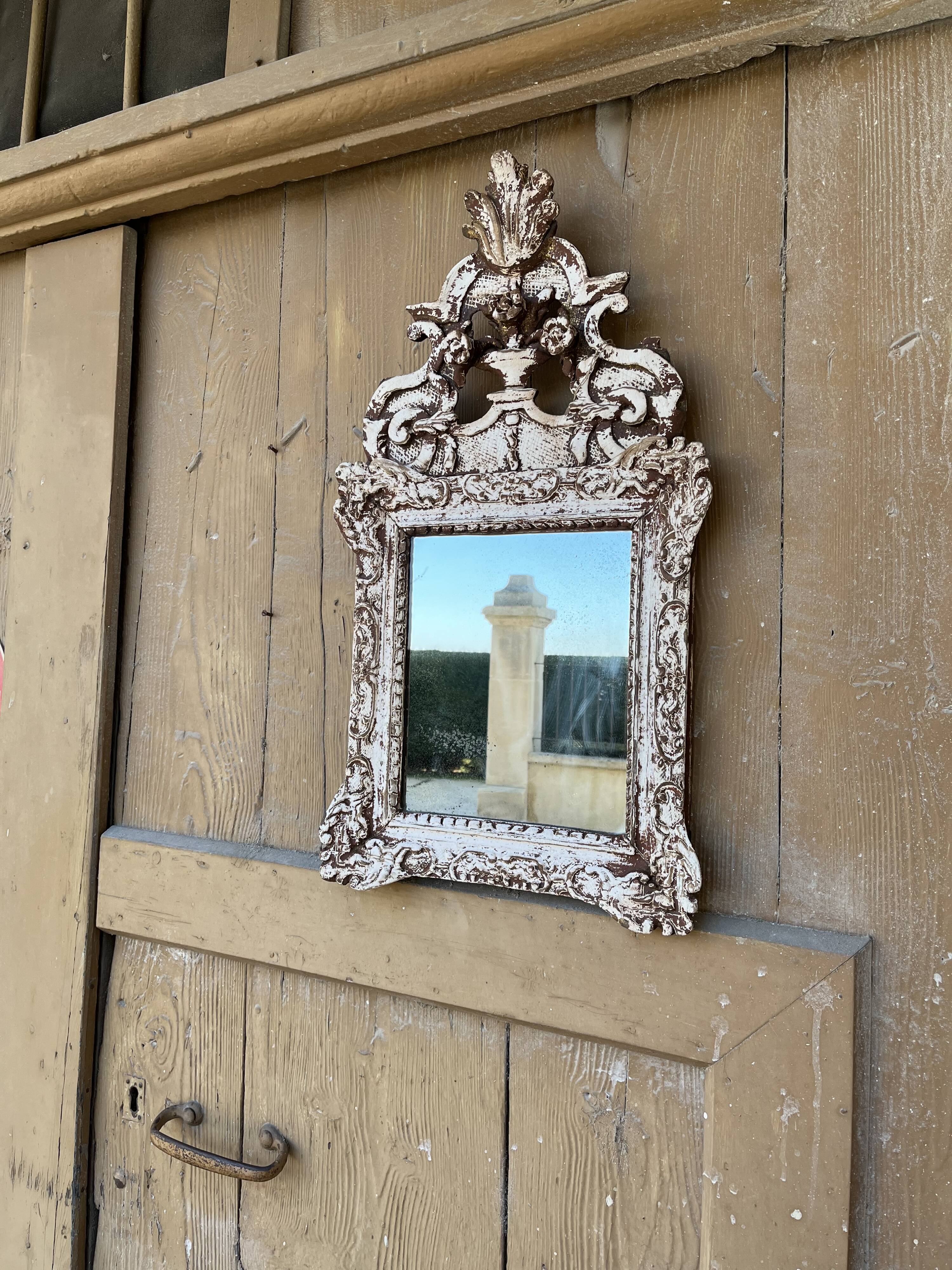 Carved wooden mirror