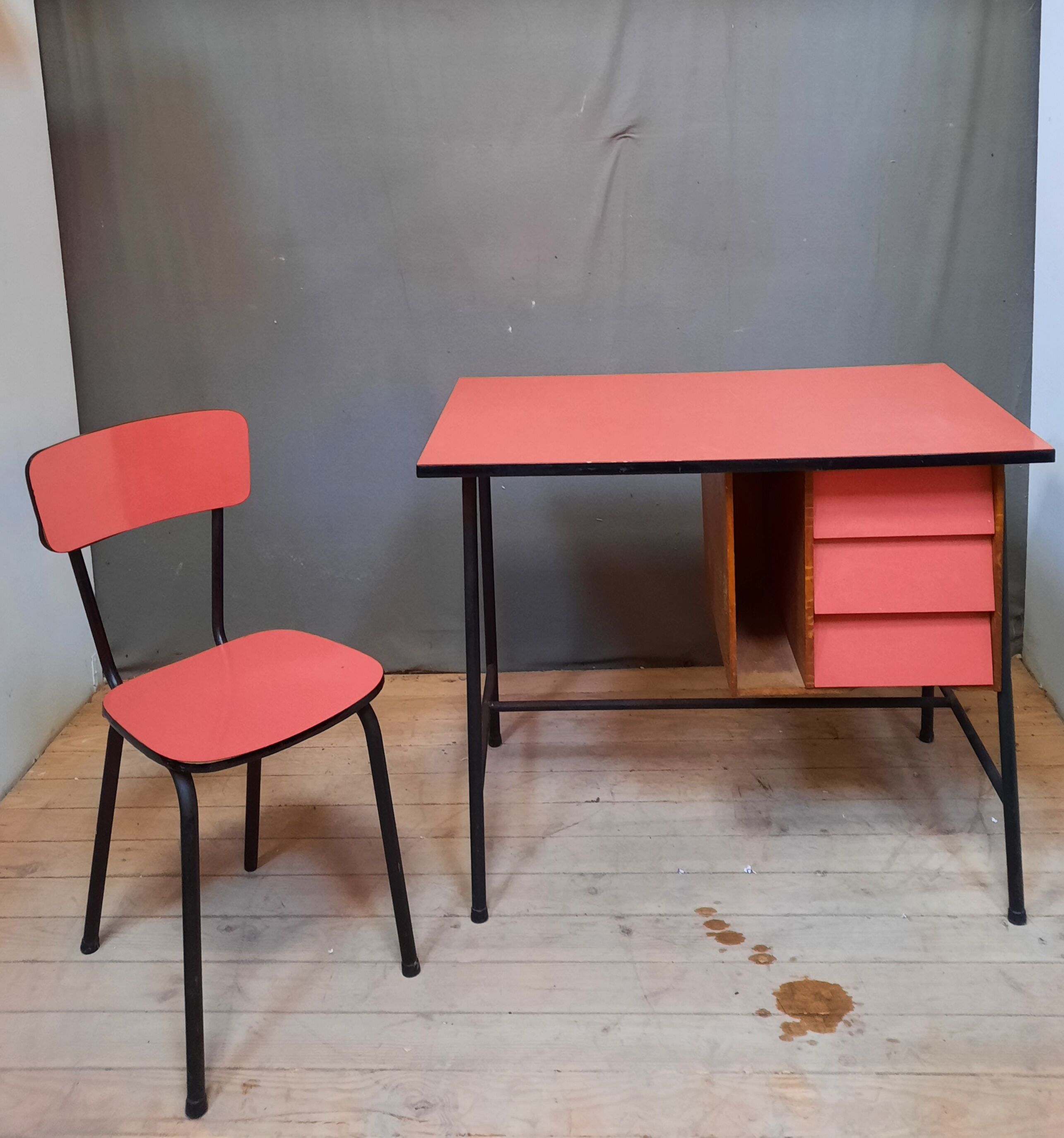 Red vintage desk and its chair
