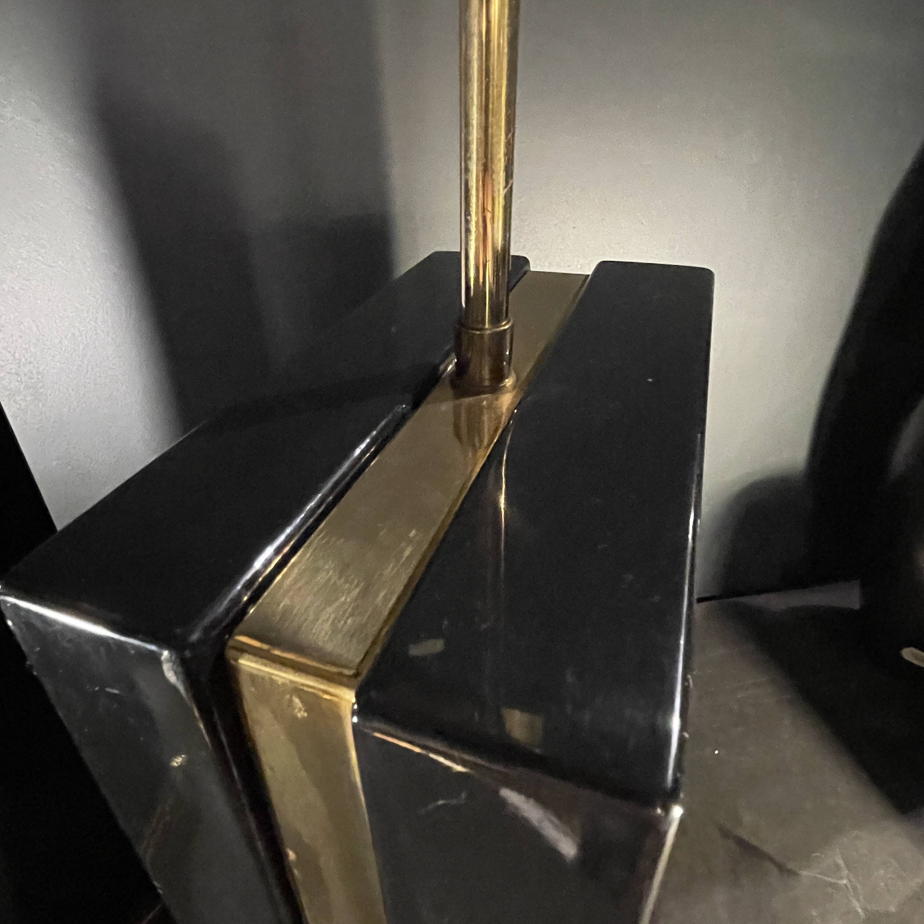 Pair of black lacquered and brass table lamps, circa 1970