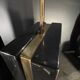 Pair of black lacquered and brass table lamps, circa 1970