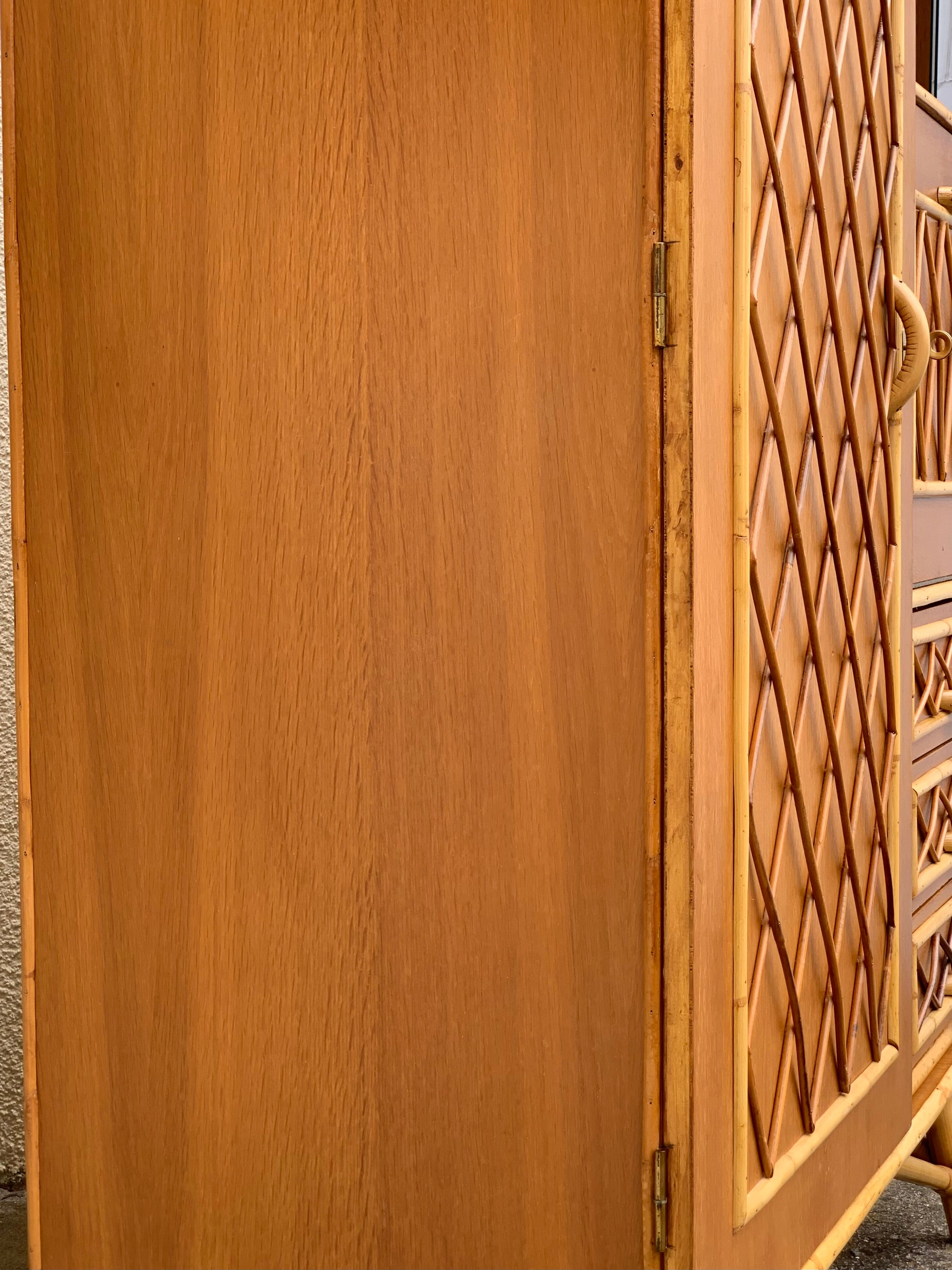 Rattan wardrobe with tapered legs from the 1960s.