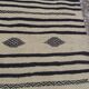 Traditional hand-woven beige and black carpet