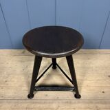 Unmarked black Rowac stool with a dark wood seat.