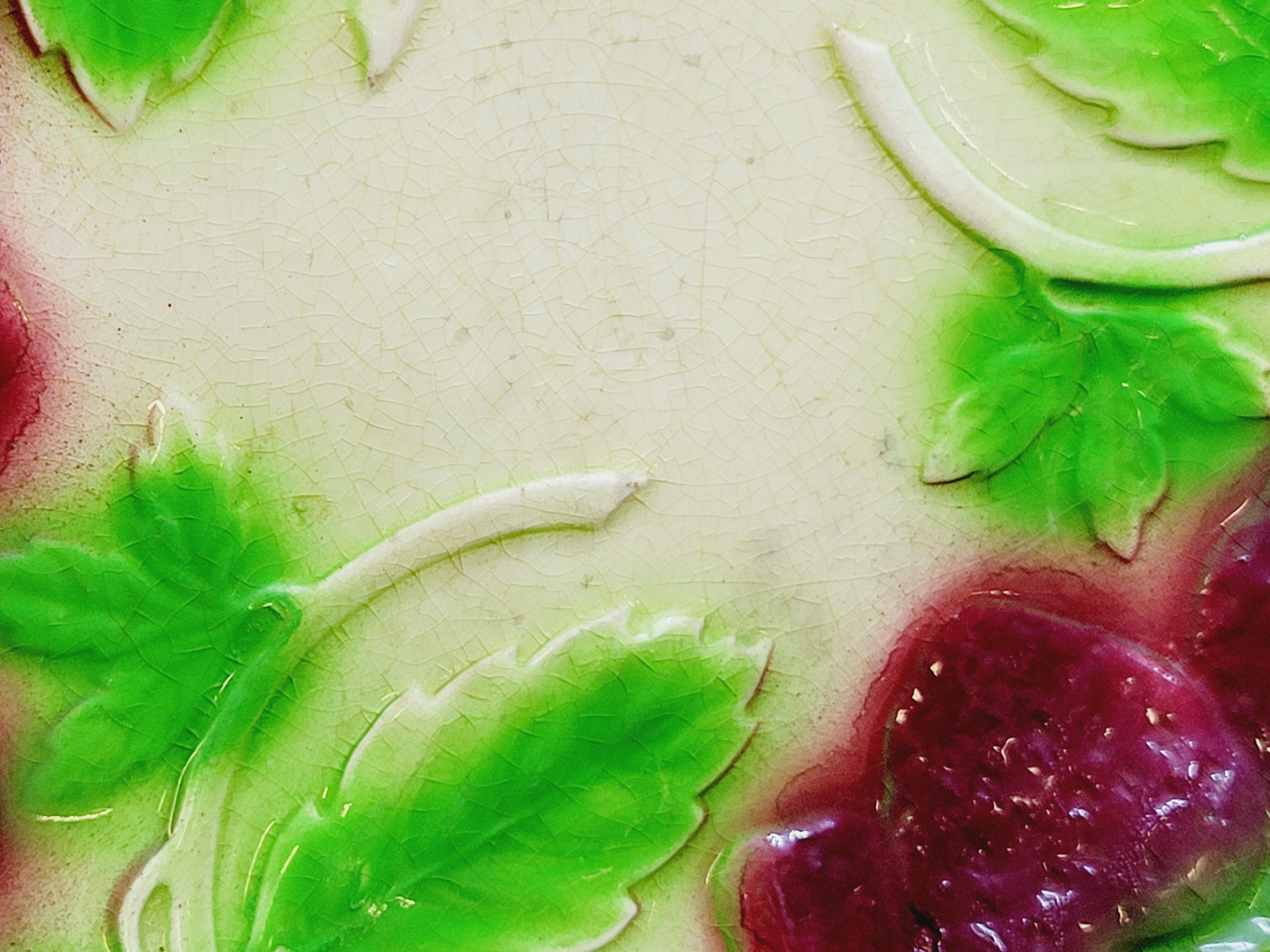 3 old plates in slip decoration strawberries and grapes