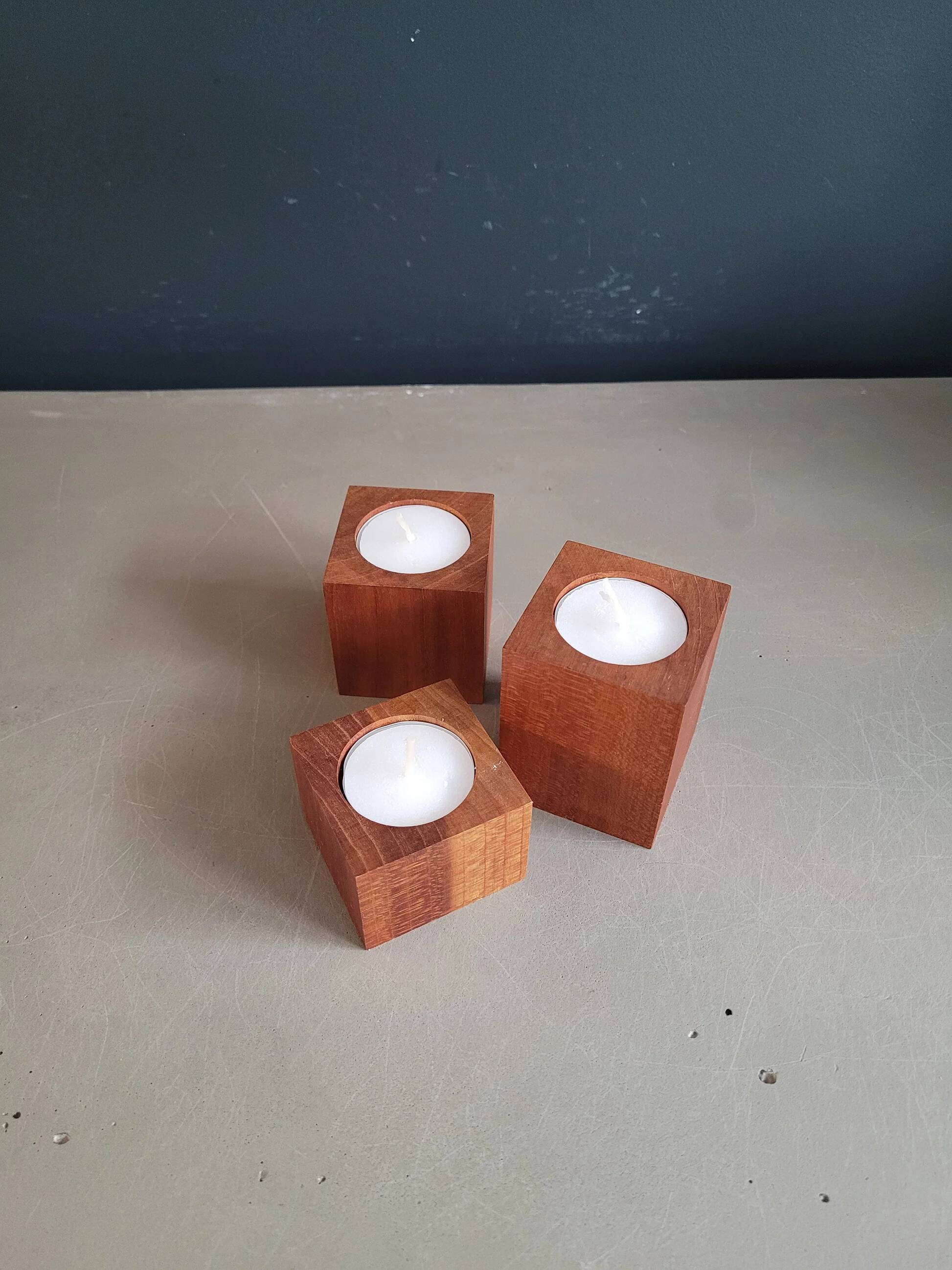 Vintage teak candlestick trio