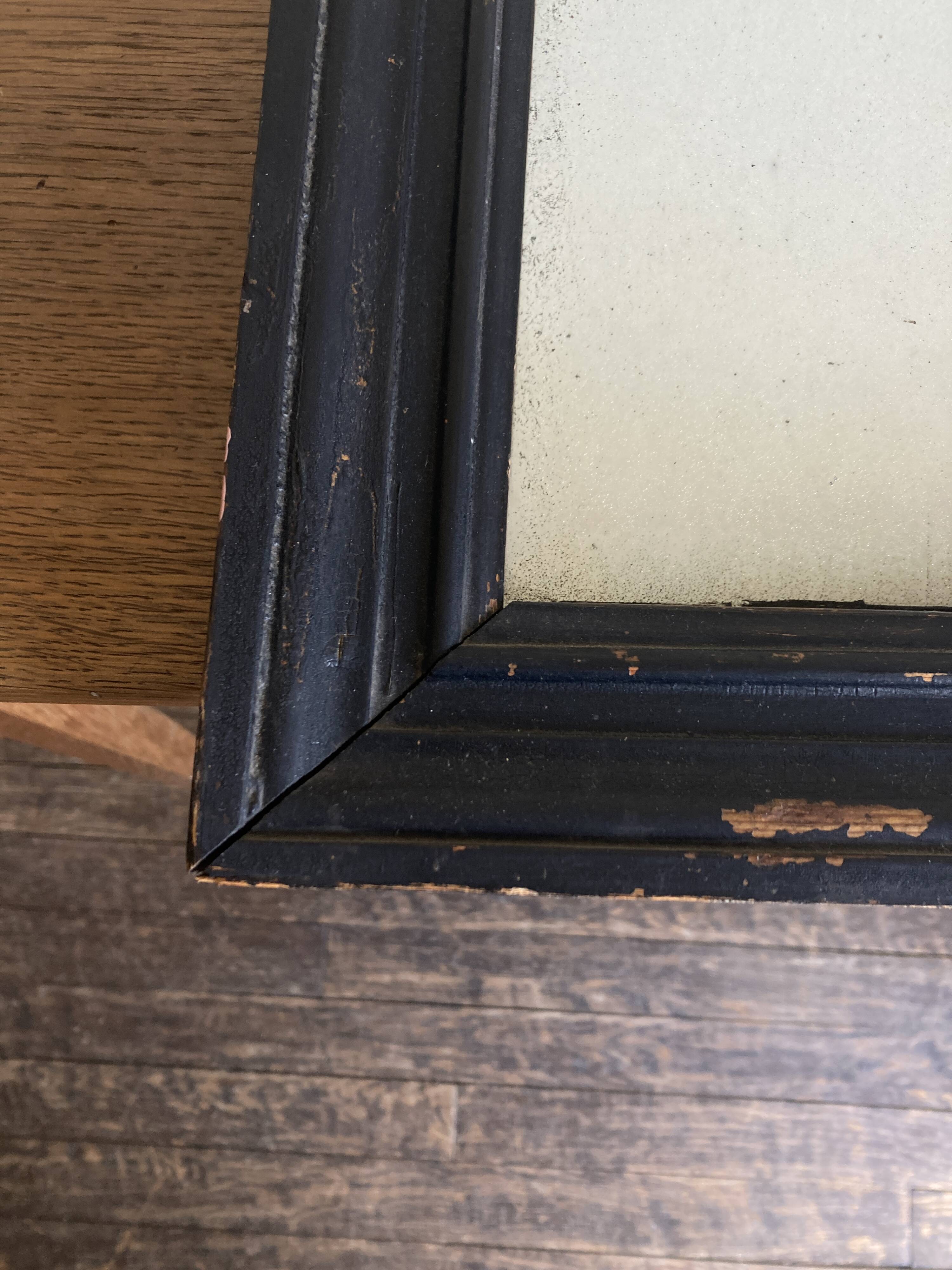 19th century blackened mirror with pitted glass 34cm x 40cm