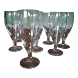 Eight champagne flutes in engraved glass
