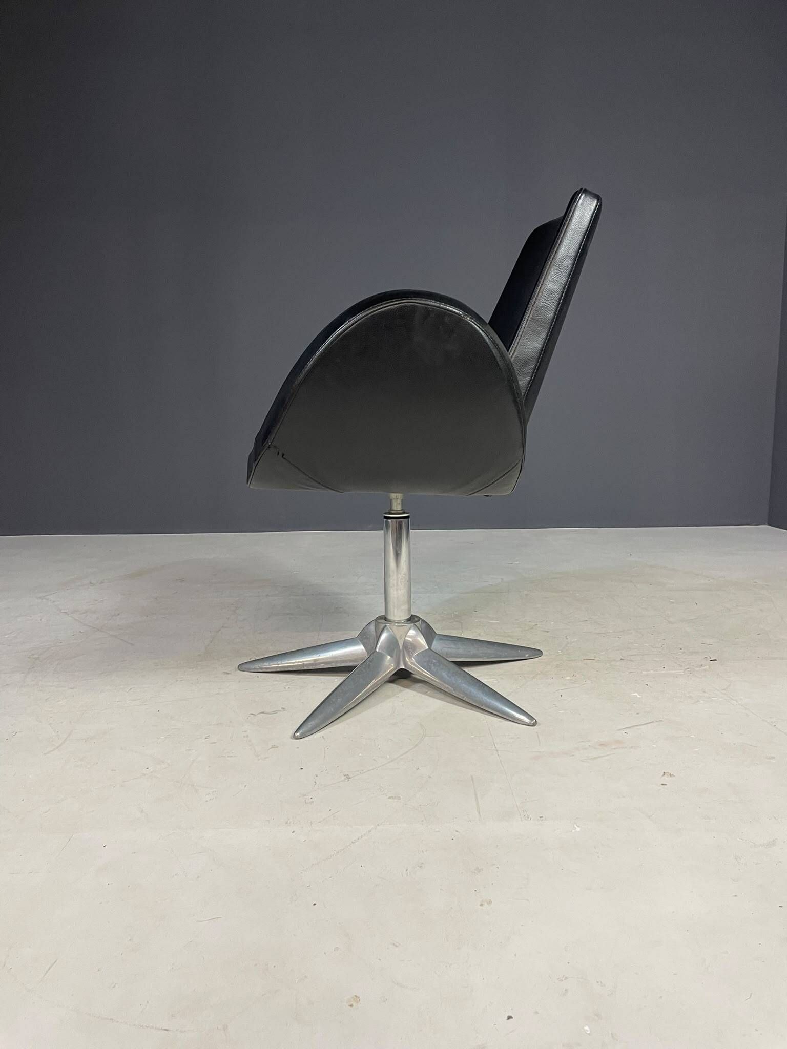 Alipes black swivel salon chair with chrome star base by Giorgetto Giugiaro