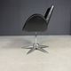 Alipes black swivel salon chair with chrome star base by Giorgetto Giugiaro