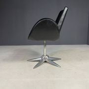 Alipes black swivel salon chair with chrome star base by Giorgetto Giugiaro