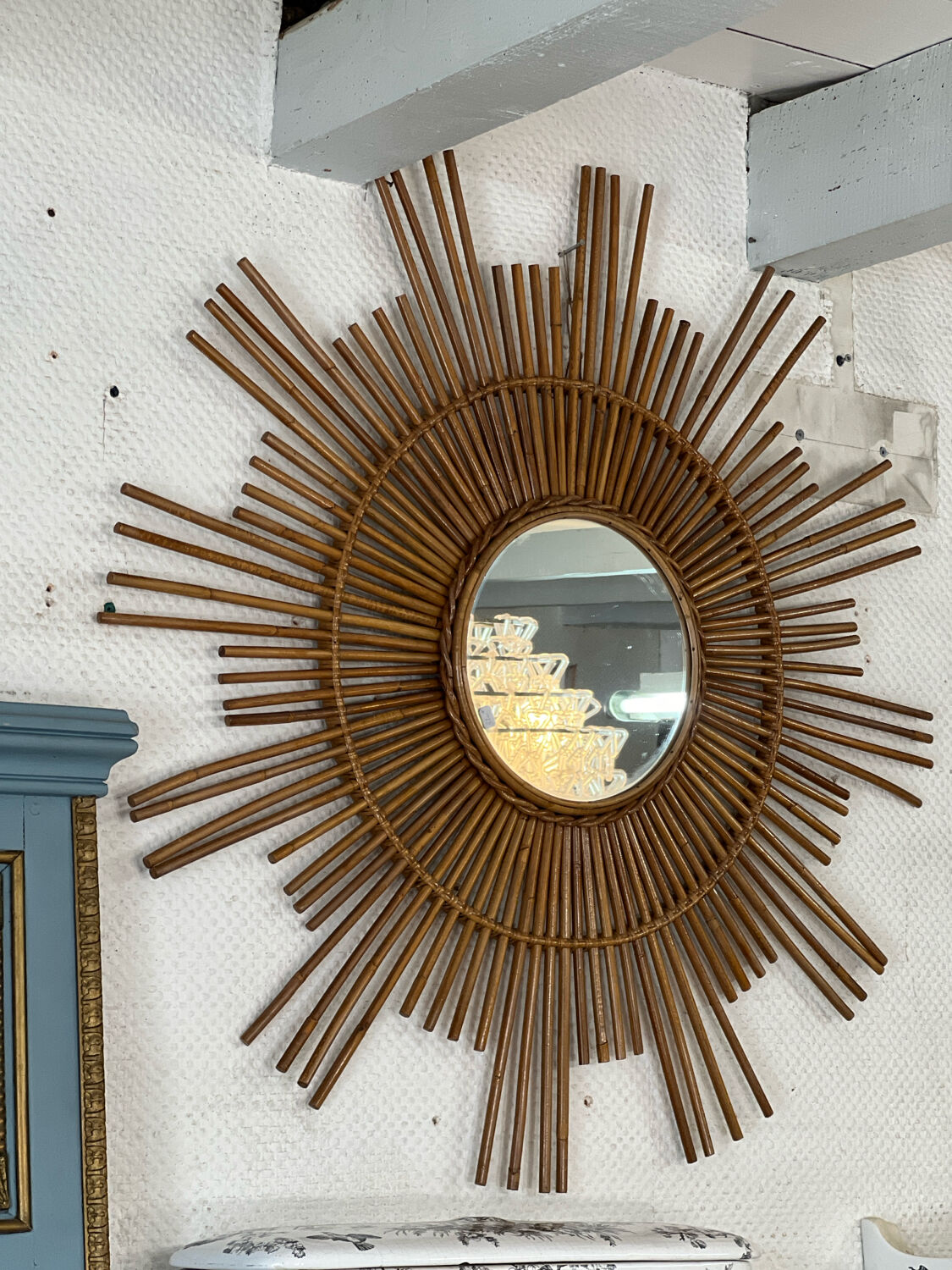 Large sun mirror in rattan