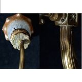 Brass wall lamp with speckled glass tulip