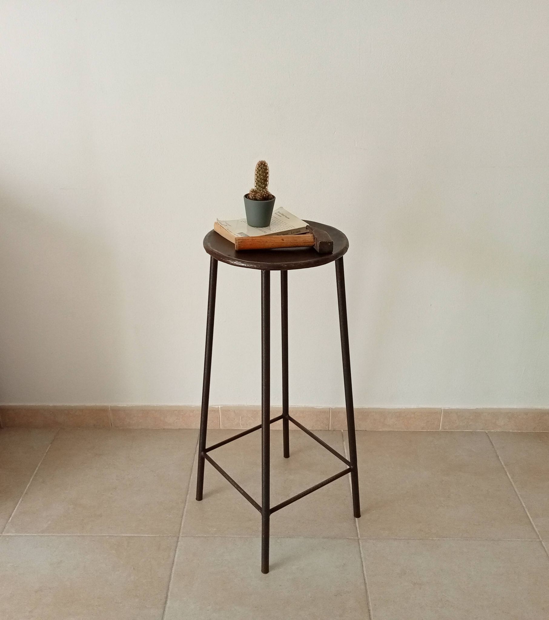 Brutalist high stool from the 1960s in solid steel.