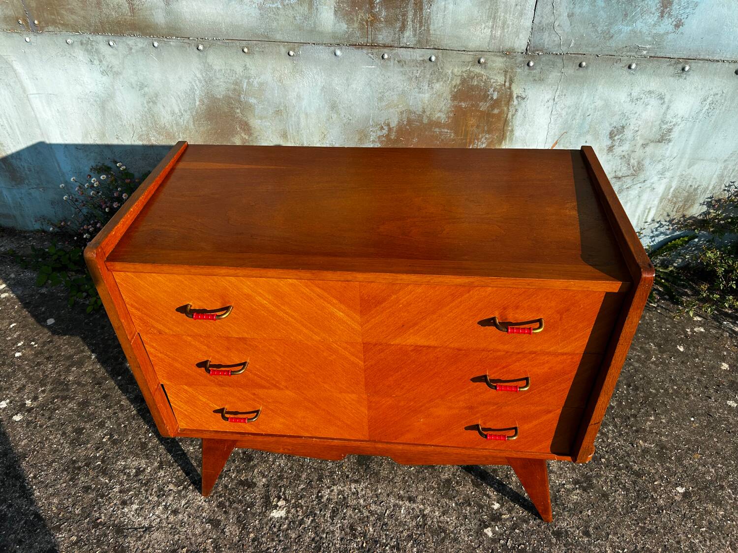 Vintage chest of drawers with compass feet.