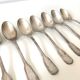 8 silver metal spoons