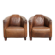 Ensemble de deux fauteuils aviateur vintage en cuir de vachette grainé.