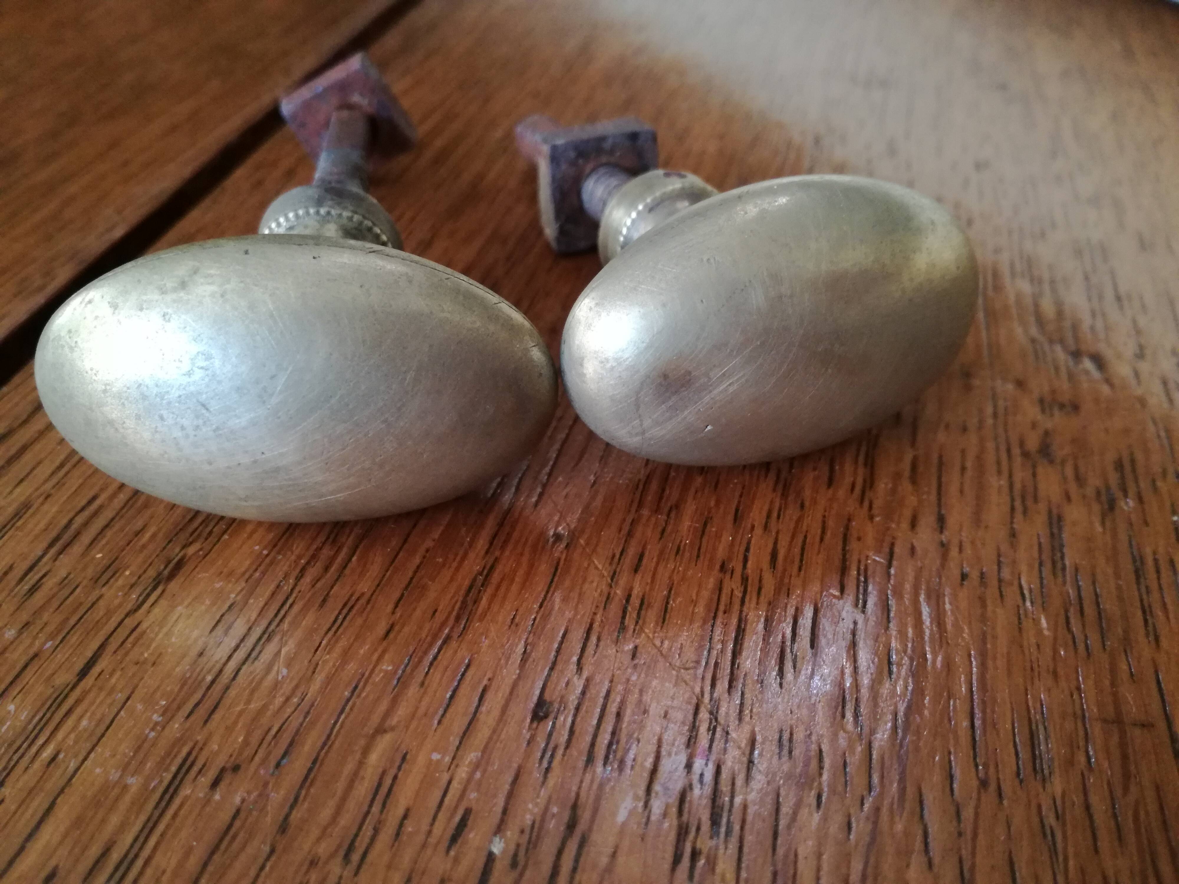 pair of old brass button handles