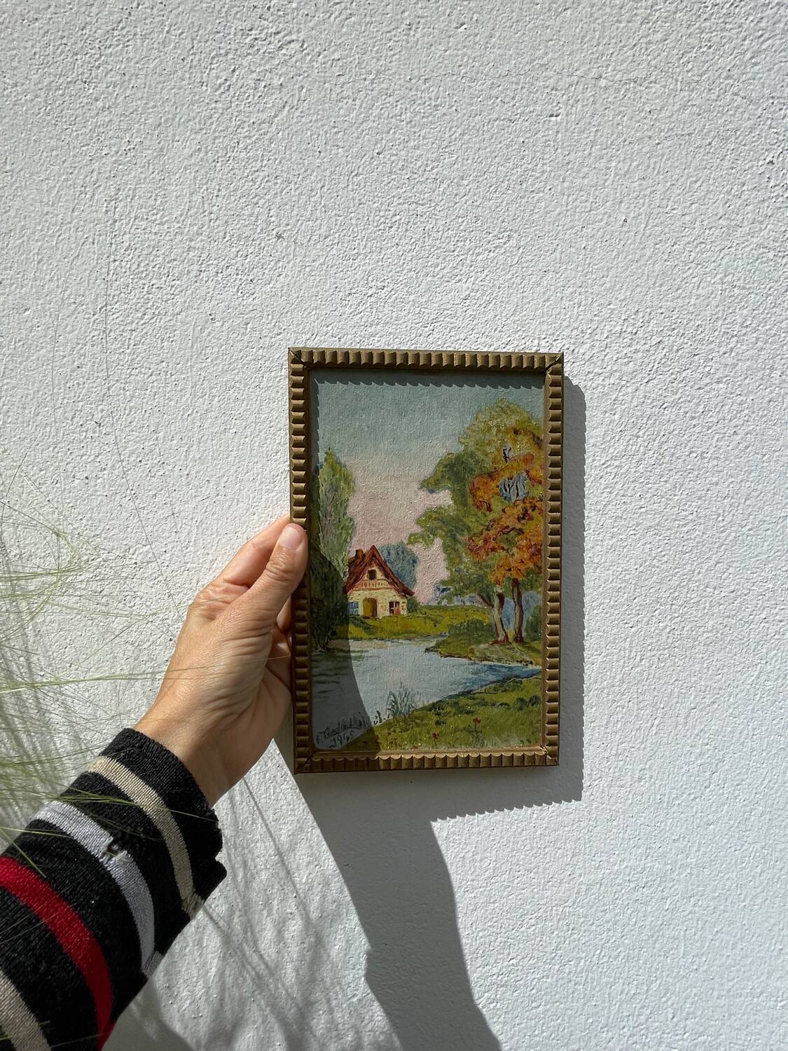 Small landscape painting with golden frame