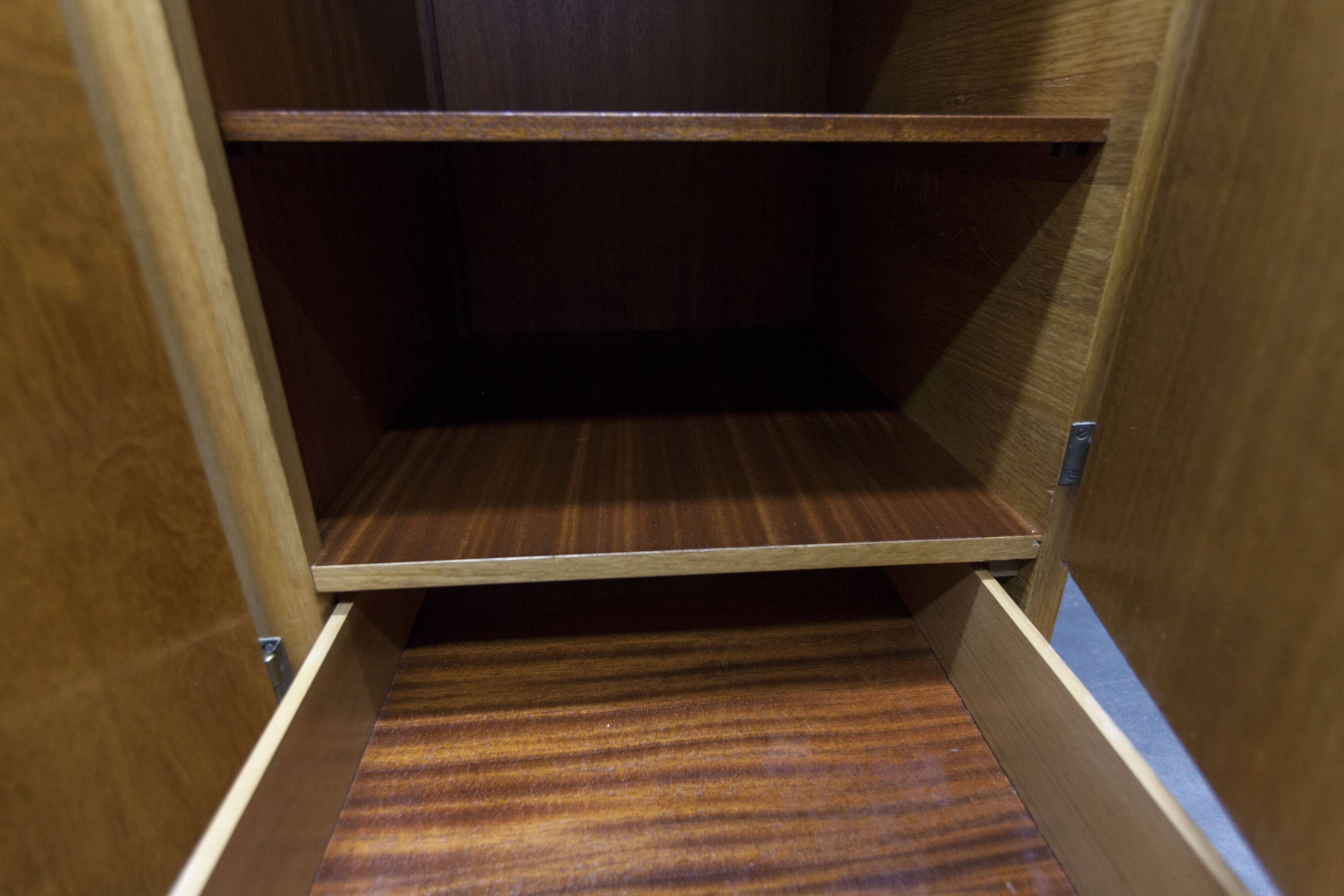 French wardrobe with tapered legs, 3 doors, 1 mirror (27*130), and 1 drawer.